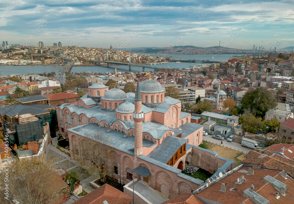 Aerial view of Molla Zeyrek Mosque in Istanbul Turkey with Galata Tower and Golden Horn on the horizon