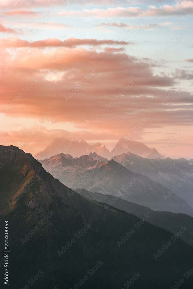 Landscape sunset Mountains peaks and clouds summer travel wild nature scenic aerial view .