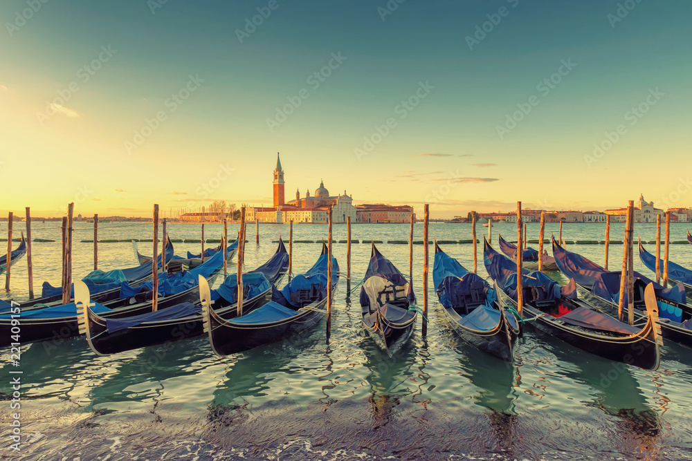 Sunrise view of traditional Gondolas on Canal Grande, San Marco, Venice, Italy.Vintage processed.