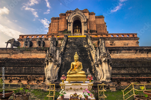 Chiang Mai - October 17, 2014: Golden Buddha statue in the Buddhist temple of Wat Chedi Luang in Chiang Mai, Thailand photo