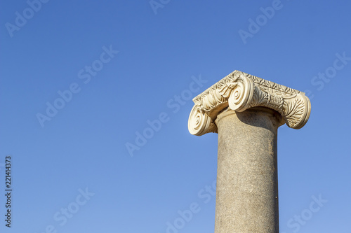 Clear shoot of antique corinthian style of stone column in Turkey with blue sky background