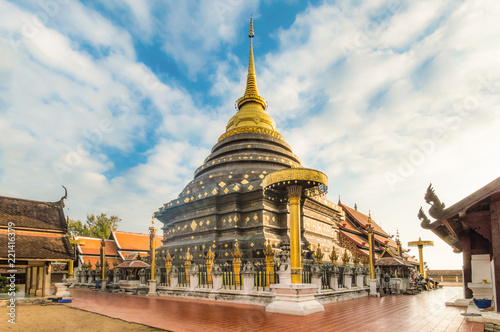 Buddhism temple lanna Golden Pagoda Phra That Lampang Luang blue sky cloudy, Lampang, Thailand photo