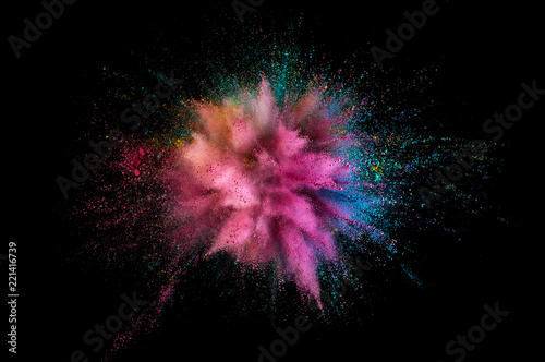 Colored powder explosion. Abstract closeup dust on backdrop. Colorful explode. Paint holi photo