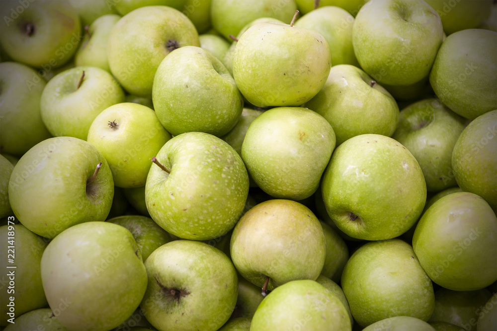 Fresh apples spread out an even layer as a background. Fresh apples spread out an even layer as a background.