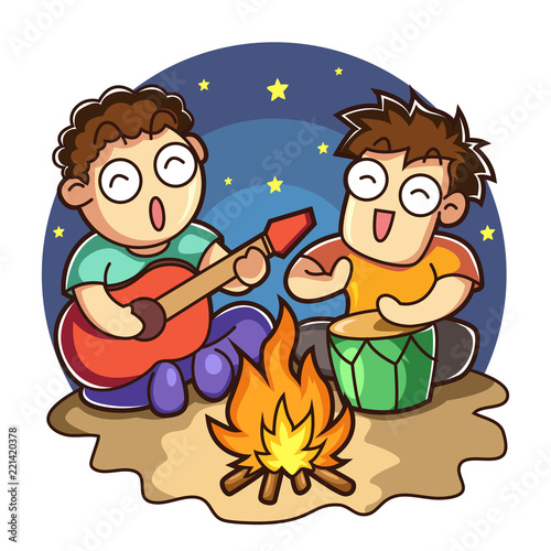 Young man near the fire playing music