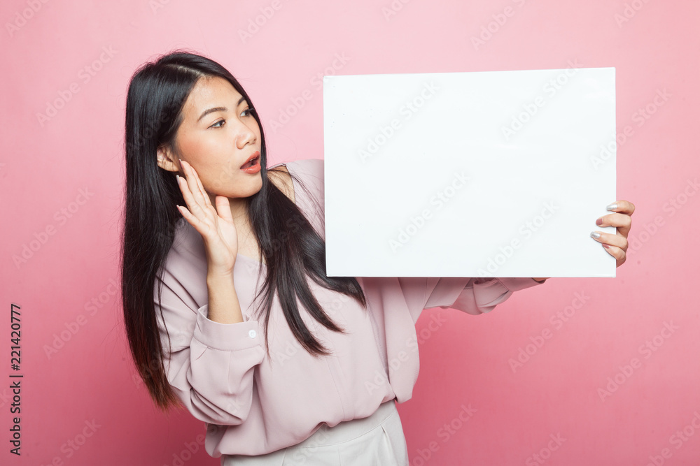 Young Asian woman surprise with white blank sign. Young Asian woman surprise with white blank sign.