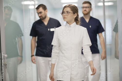 group of doctors posing in hospital / concept modern medical clinic, doctor's work, medical uniform, medical team © kichigin19