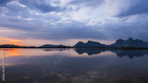 time laps of colorful sunrise with mountains on water under movement of cloudy sky located Khao Sam Roi Yot National Park Prachuap Khiri Khan south of Thailand
