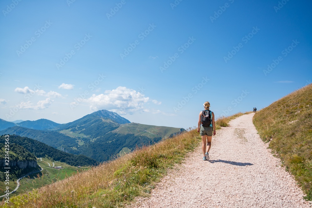 Woman on mountain trail.