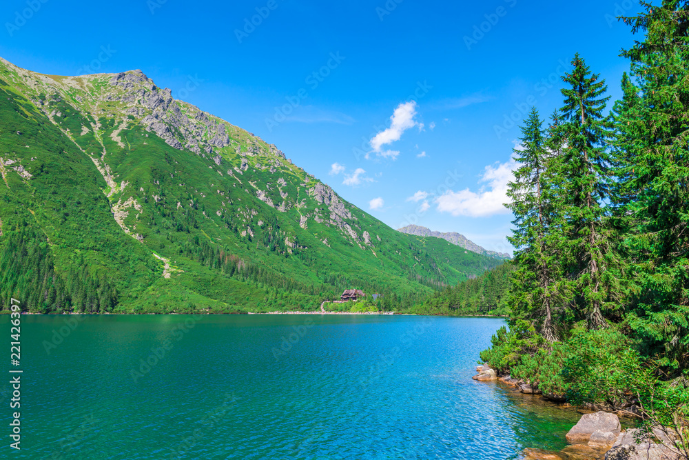 a picturesque clean mountain lake in the Tatras, a landmark of Poland - Morskie Oko