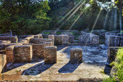 Sunbeams affect part of the Cisiarii spa complex in Ancient Ostia - Rome photo