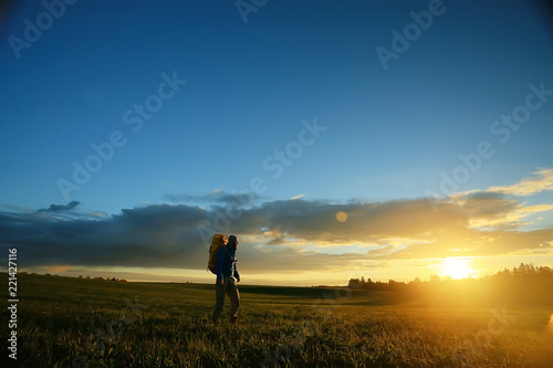 traveler sunset, man at sunset travels, extreme vacation, single tourism concept, trekking, landscape with man, beautiful sunset