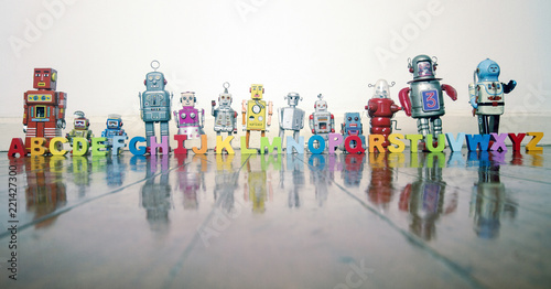 alphabet  robots standing on a wooden floor