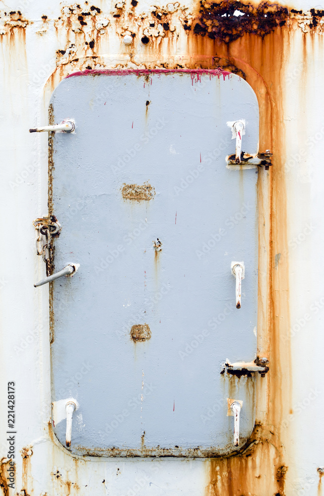 Rusty door on the cargo ship Rusty door on the cargo ship