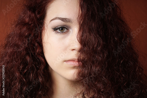  portrait of sullen girl with natural curly long hair 