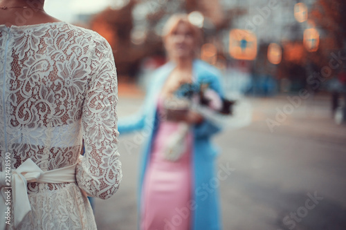 Bride in a white dress at a wedding is beautifully solemn
