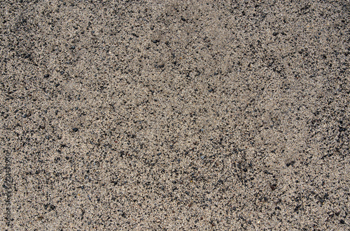 Dark canarian volcanic sand texture close up. Natural background. 