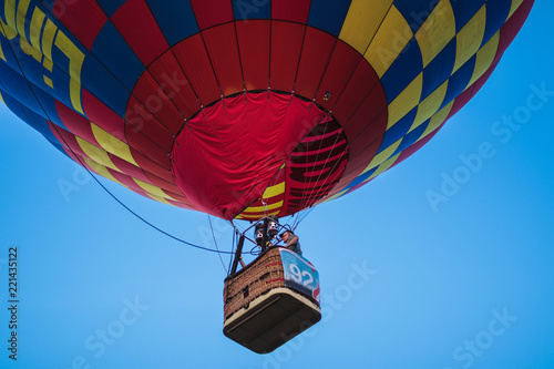 a beautiful hot air balloon with a bright blue sky in the background