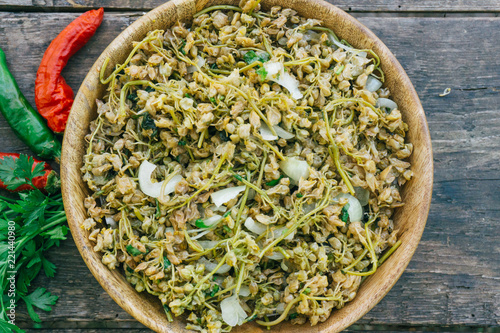 JONJOLI (Staphylea colchica, Caucasian bladdernut or Colchis bladdernut). Traditional Georgian food - pickled appetizer on a wooden table photo