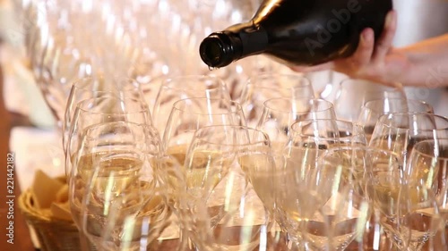 WOMAN POURING WHITE WINE photo