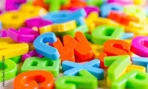Plastic colored letters and numbers. Alphabet background