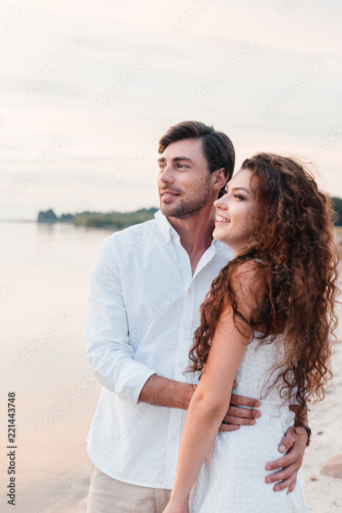 beautiful romantic couple hugging on seashore beautiful romantic couple hugging on seashore
