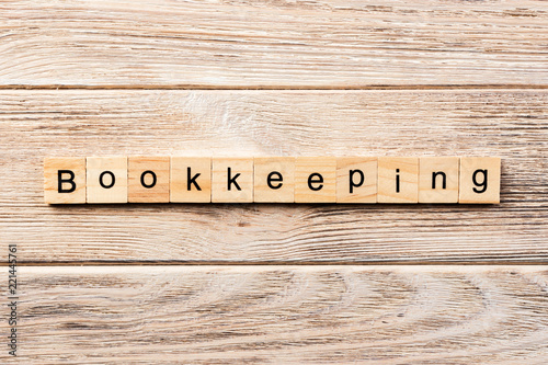 bookkeeping word written on wood block. bookkeeping text on table, concept photo