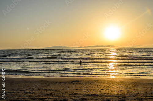Beach of Black Sea from Mamaia, Romania at sunrise , warm sunshine atmosphere