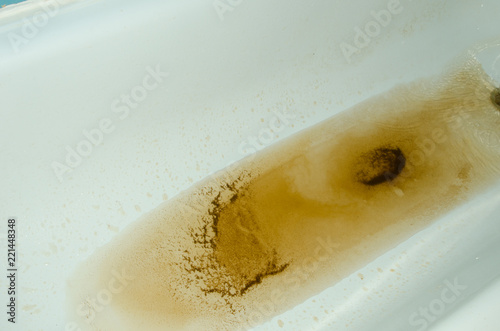 rusty water runs out of the tap