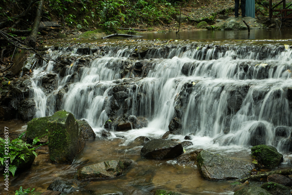 Fototapeta premium Waterfalls flowing down from the stream at 
