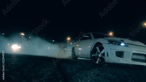 Sports car swiftly sweeps past the camera in drift photo