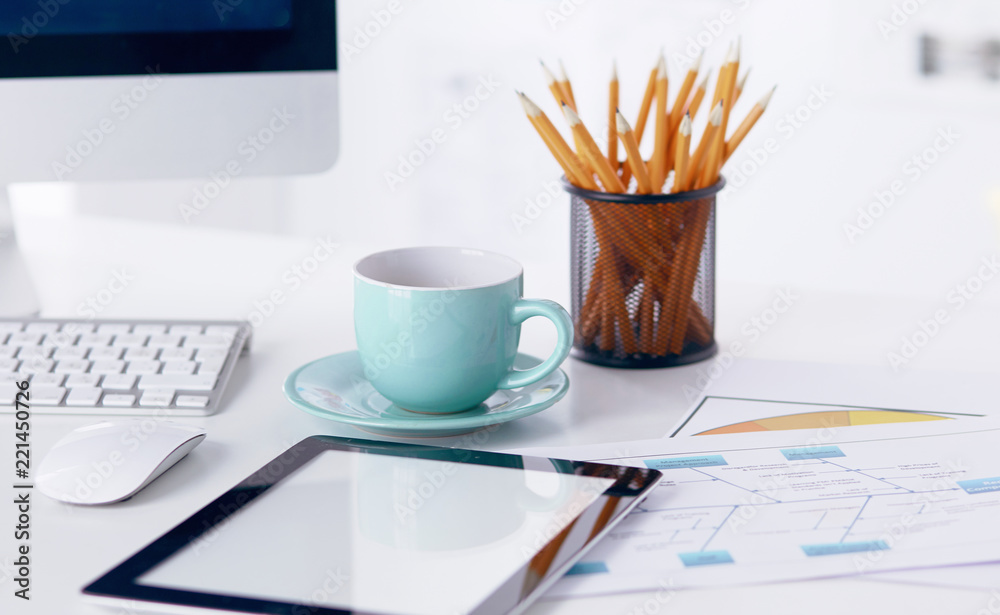A cup of coffee on the office table A cup of coffee on the office table