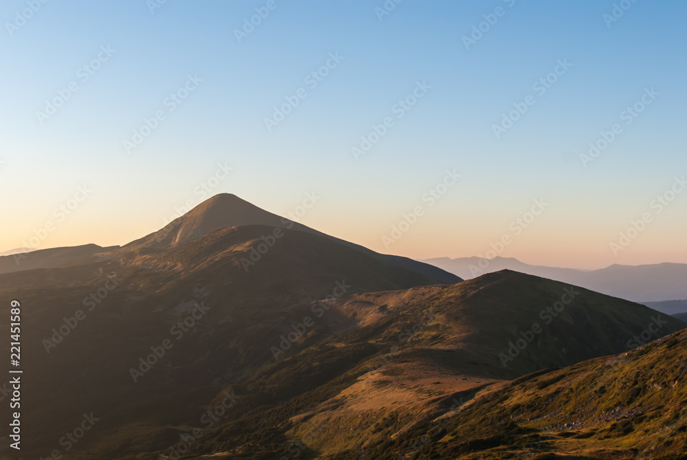 Landscape with mountains and clouds. Ukraine, Zakarpattia region, Rakhiv district, Carpathians, Chornohora, mountain Hoverla.