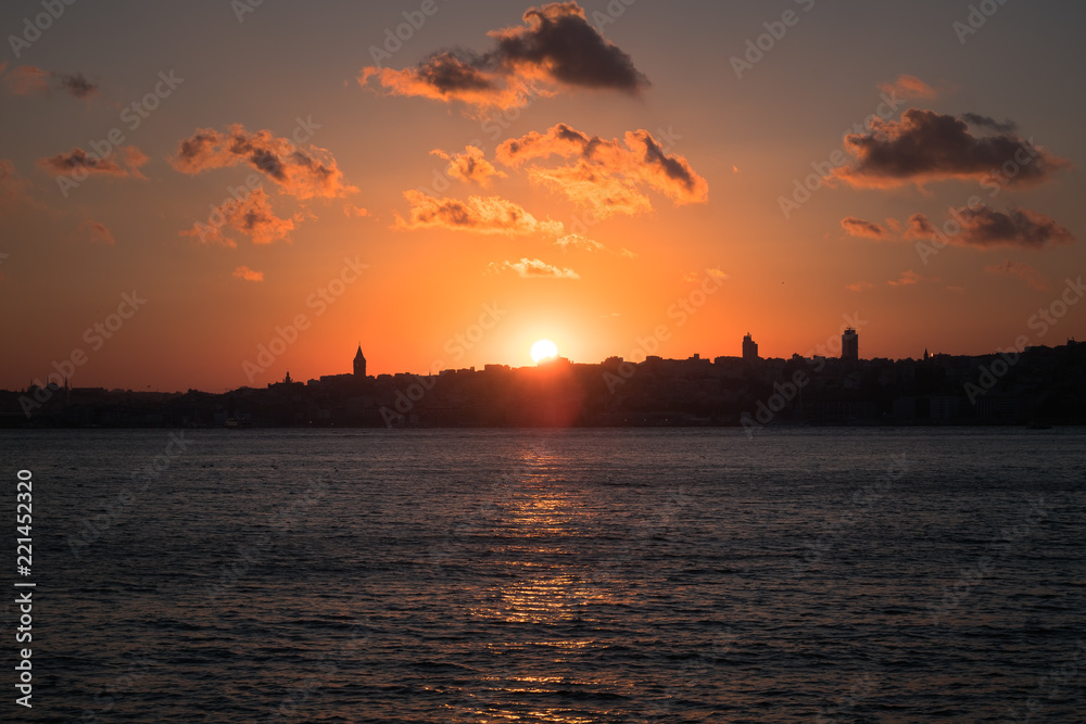 Panaromic View of Istanbul city and steamboats. Sunset in Galata Tower.