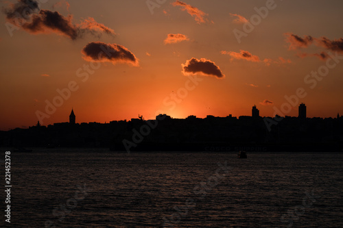 Panaromic View of Istanbul city and steamboats. Sunset in Galata Tower.