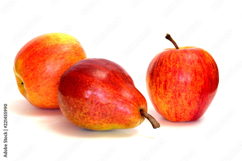 Red apples and pear on a white background. Red apples and pear on a white background.