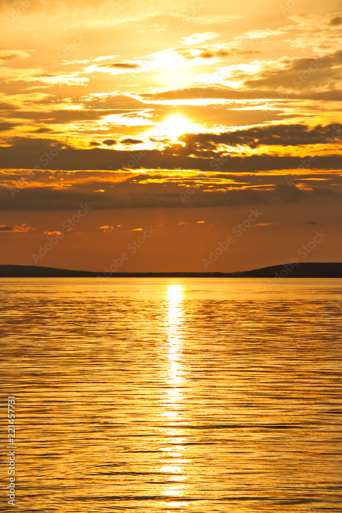 The sun setting over Waskesiu Lake in Prince Albert National Park of Canada. The sun setting over Waskesiu Lake in Prince Albert National Park of Canada.