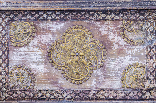 Beautiful antique indian furniture. Old wooden pattern texture. Vintage furniture with ornament.