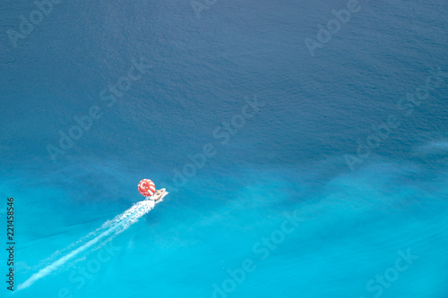 Fethiye, Mugla/Turkey- August 19 2018: Parasailing, also known as parascending or parakiting on Mediterranean Sea photo