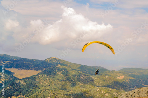 Fethiye, Mugla/Turkey- August 19 2018: Paraglider flying just after jump on Babadag