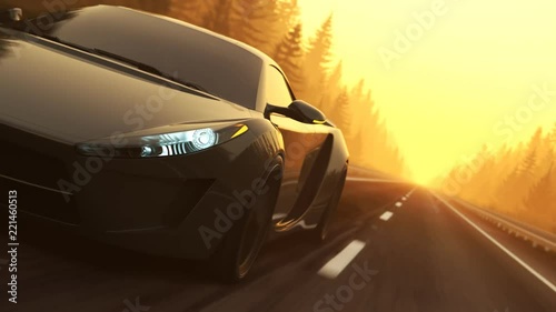 Fast, slick supercar endless driving through a coniferous forest during sunset. photo