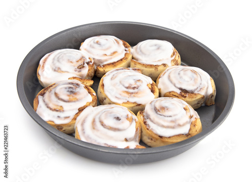 Fresh Cinnamon Rolls with White Icing in a Baking Pan