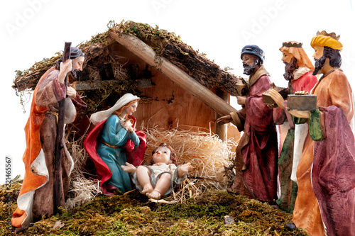Stampa su tela Christmas nativity scene with Holy Family in the hut and the three wise men, iso
