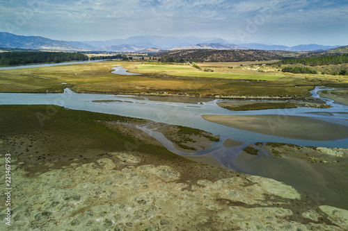 An aerial view of Salinas de Pulllally beach at Valparaiso region an amazing and wild beach with sand dunes, a delta river and a very nice surf spot at central Chile photo