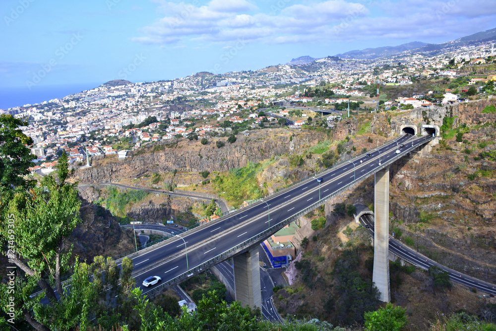 View of Funchal city with highway bridge and architecture, Madeira island, Portugal