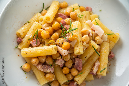 Dish of italian pasta with chickpeas and bacon 