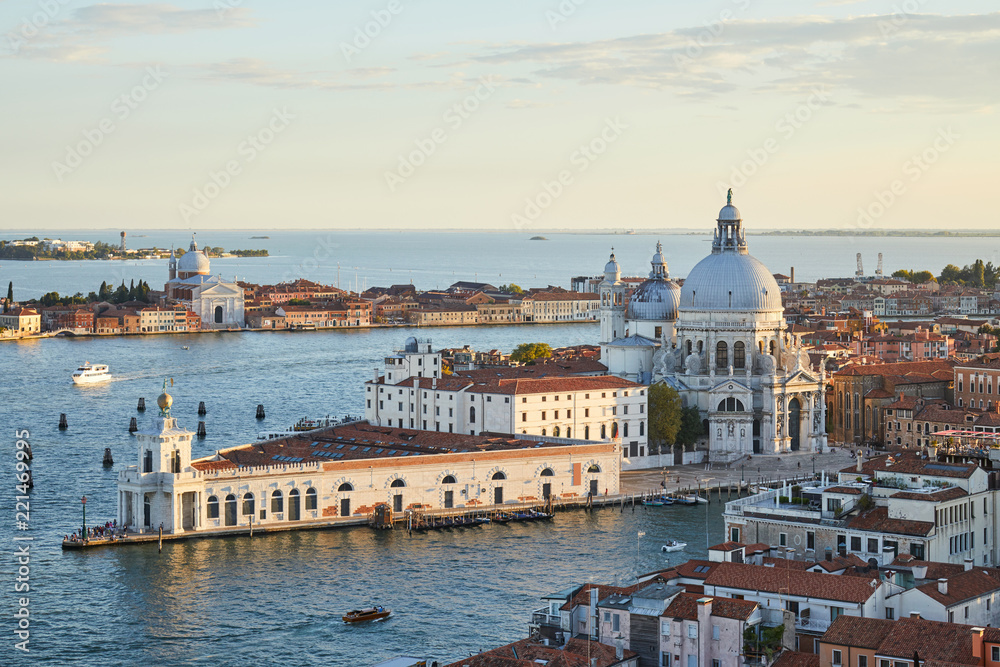 Saint Mary of Health basilica in Venice and Punta della Dogana, aerial view at sunset in Italy
