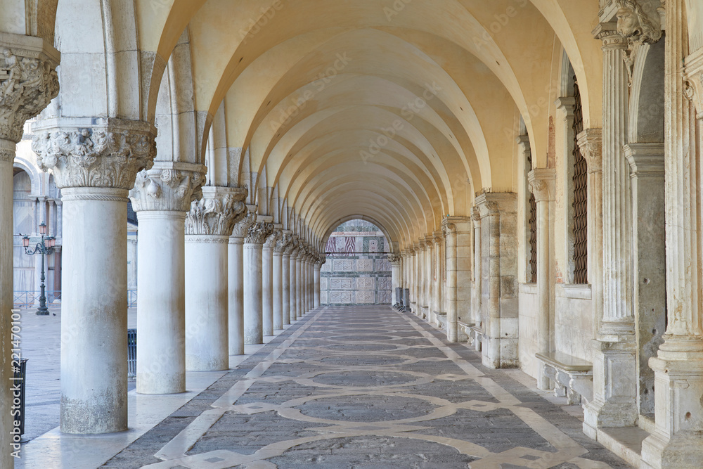 Venice, Doge palace ancient and white arcade, nobody in the morning
