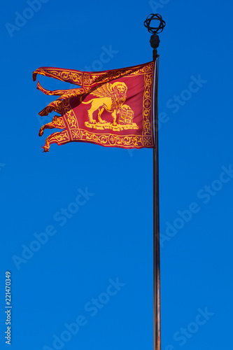 Venice republic Serenissima flag in the wind, clear blue sky in a sunny day