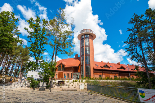 DEBKI, POLAND, AUGUST 15, 2017: Lighthouse tower building in Debki. Debki is the fishing village standing at the mouth of the Piasnica River to the Baltic Sea, Poland.